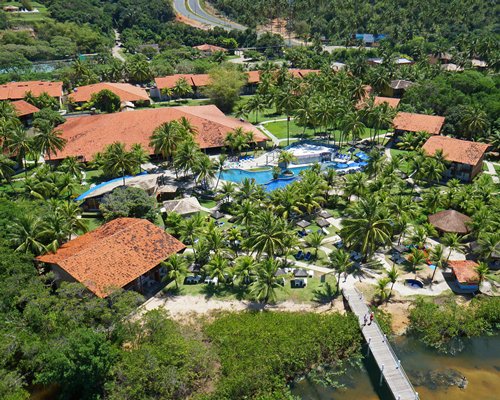 An aerial view of the resort property surrounded by wooded area.