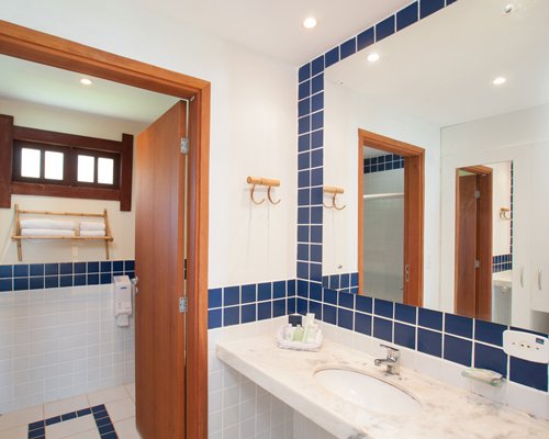 A bathroom with single sink vanity.