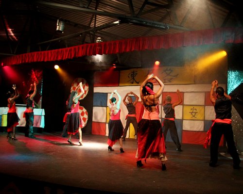 A group of people engaged in a stage performance.