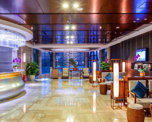 A well furnished reception area with lounge access and television.