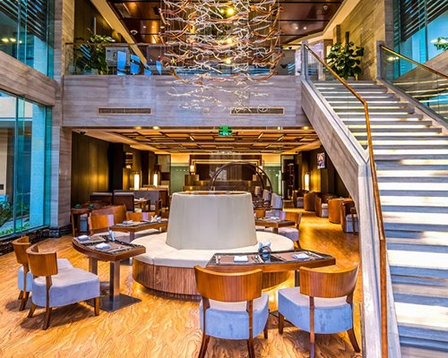 A fine dining restaurant alongside a staircase.