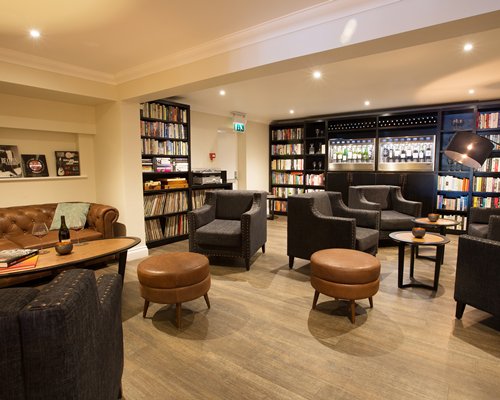 A well furnished indoor lounge area with a library.