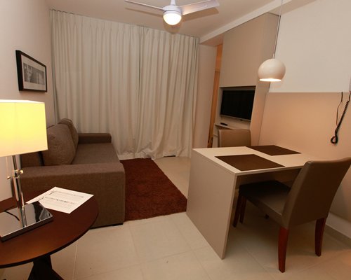 A well furnished living room with a television.