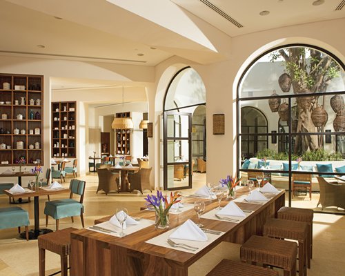 An indoor fine dining restaurant with an outside view.