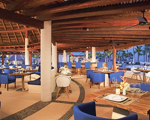 An indoor fine dining area with a bar.