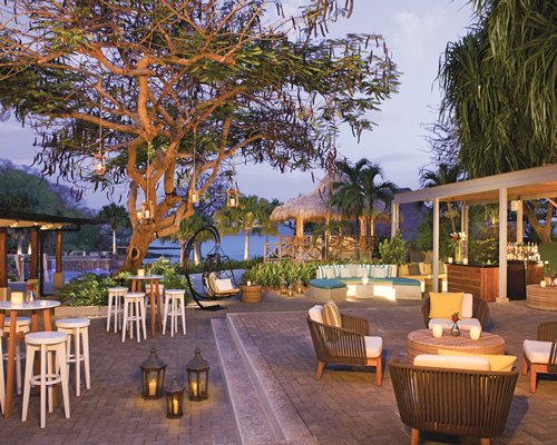 A well equipped outdoor bar with lounge area alongside the waterfront.