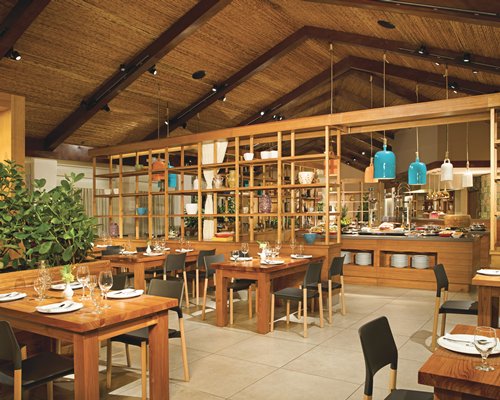 An indoor fine dining restaurant with a buffet area.