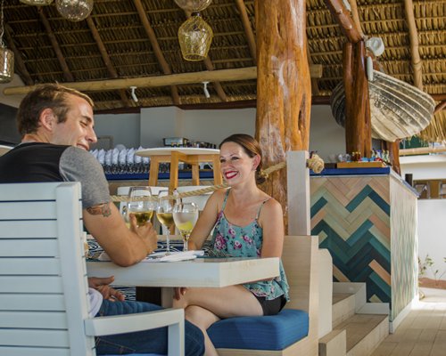 A couple in the well equipped outdoor bar.