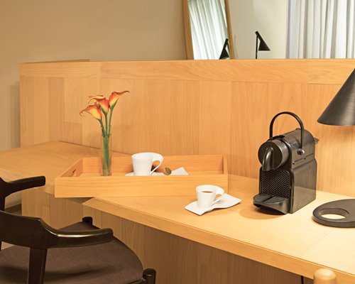 A coffee maker on the table.