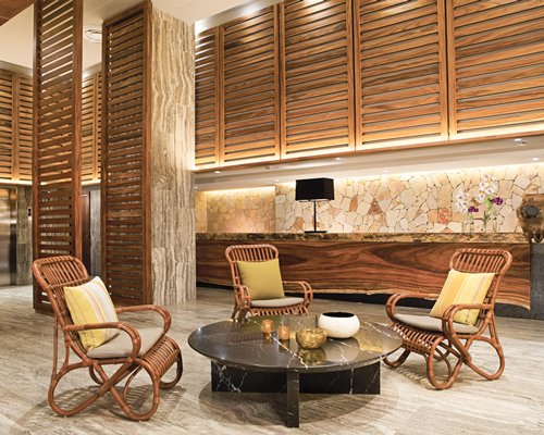 A well furnished room with patio furniture.