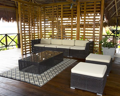 A thatched covered lounge area.
