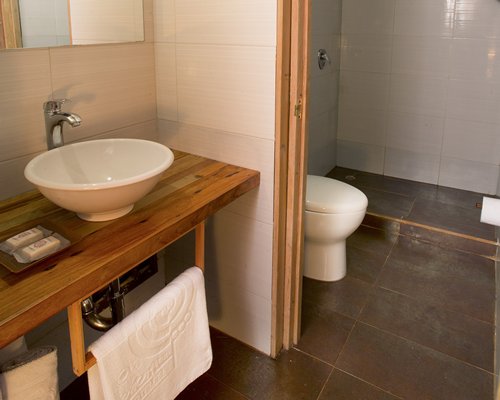 A bathroom with single sink vanity.