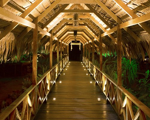 A well lit wooden pathway.