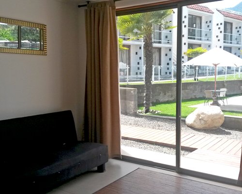 A well furnished indoor room with a patio.