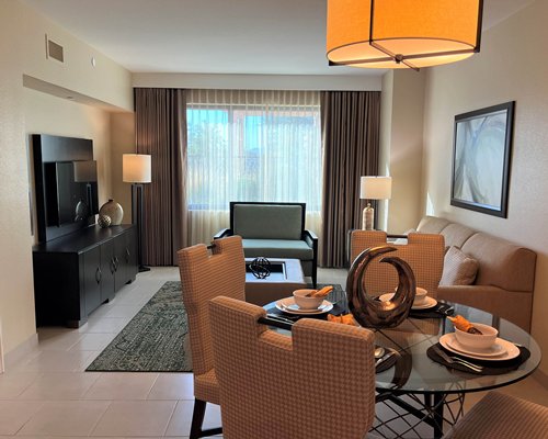 A well furnished living room with a pull out sofa.
