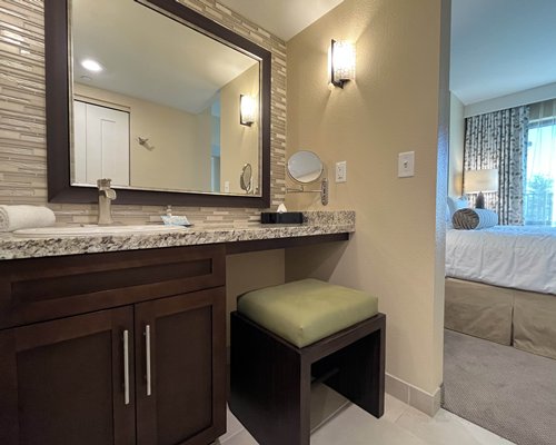 A bathroom with a shower bathtub and a vanity.