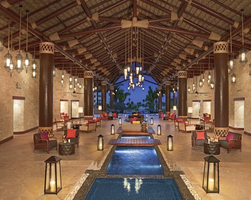 A well furnished indoor lounge area with waterfront.