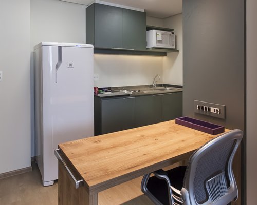 A well equipped kitchen and breakfast bar.