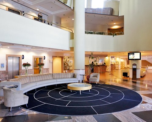 A well furnished reception area with television and lounge access.