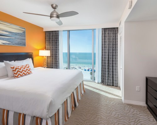 A WELL FURNISHED BEDROOM WITH PATIO.
