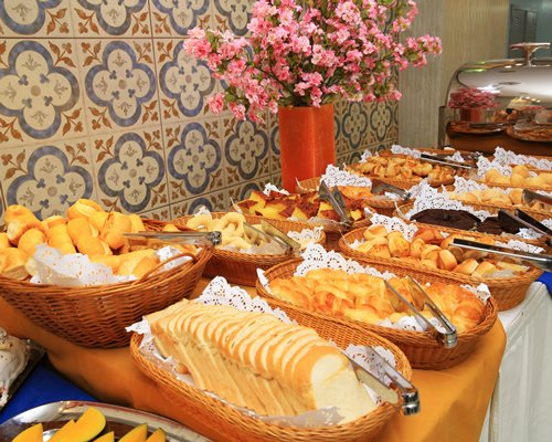 An indoor buffet area with various dishes.