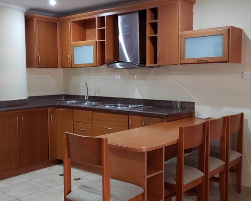 A kitchen with an oven and refrigerator.