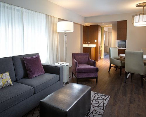 A well furnished living and dining area alongside the kitchen.