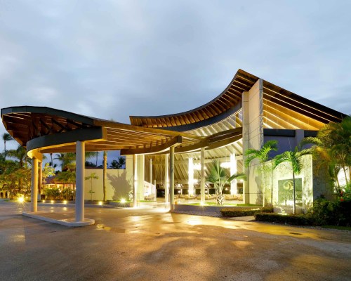 Grand Palladium Palace Resort Spa & Casino, building with palm trees