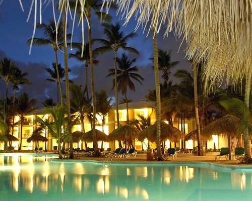 evening poolside, cabanas and lounge chairs, Grand Palladium Palace Resort Spa & Casino