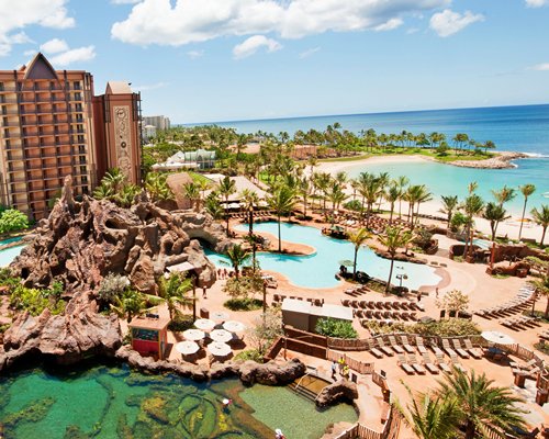 An exterior view of the Aulani Disney Vacation Club Villas and its property alongside the ocean.
