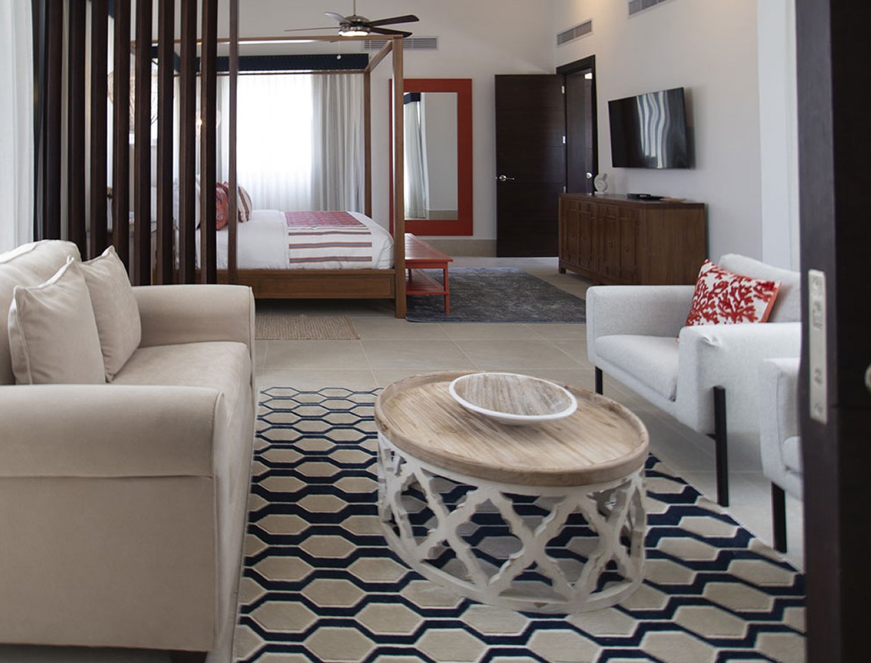 Interior view of bedroom suite with comfy sitting area