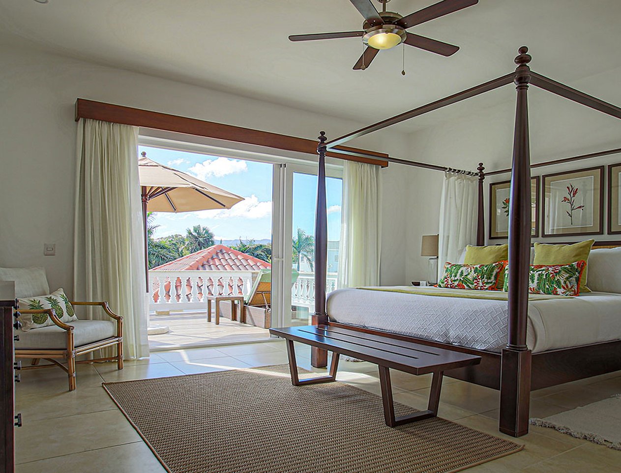 Interior view of canopy bed in bedroom with sundrenched patio attached