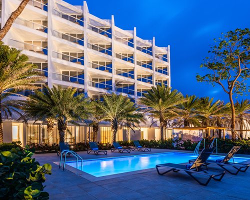 The magical view of the pool with the illuminating lights at Dreams Karibana Resort