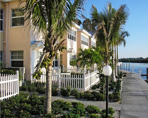 Scenic exterior view of Barefoot Beach Resort alongside the waterfront.