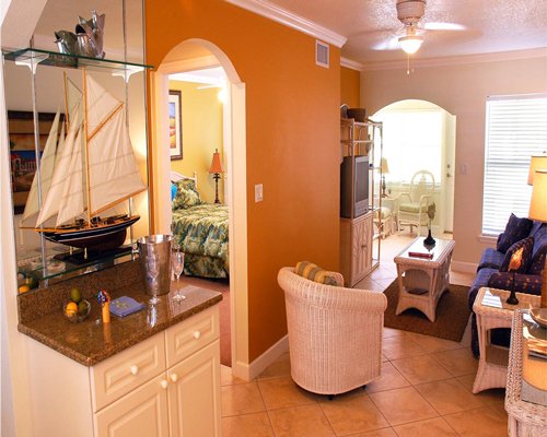 A well furnished living room with a television and an outside view.