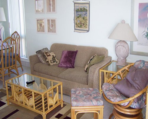 A well furnished living area with dining area and an outside view.