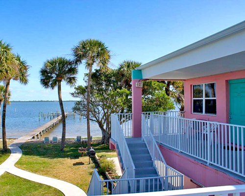 Two story unit overlooking a wooden pier on the Indian River Lagoon.