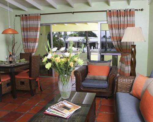 A well furnished living room with a dining area.