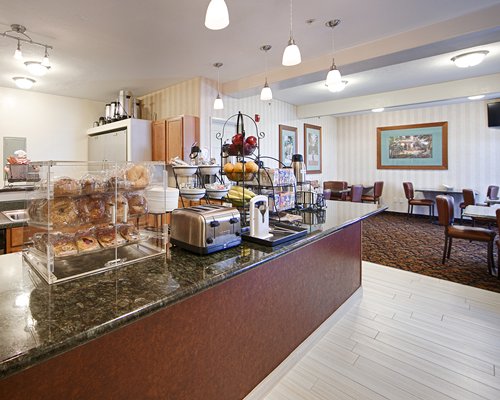 Luncheonette counter with dining tables.