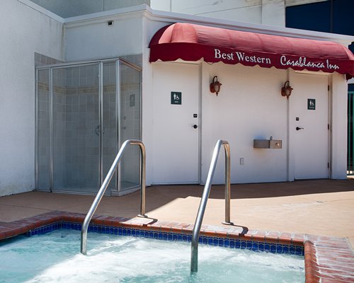 Close up of resort pool and outdoor shower area.