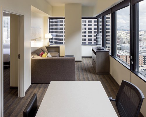 Bedrooms with the aerial view of the city through the window