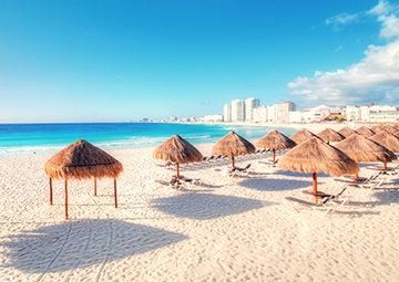 Image of the Grass Umbrellas on the beach in Cancun