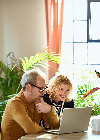 couple looking at laptop computer