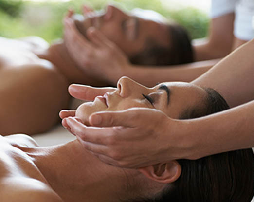 A couple receiving facial massages