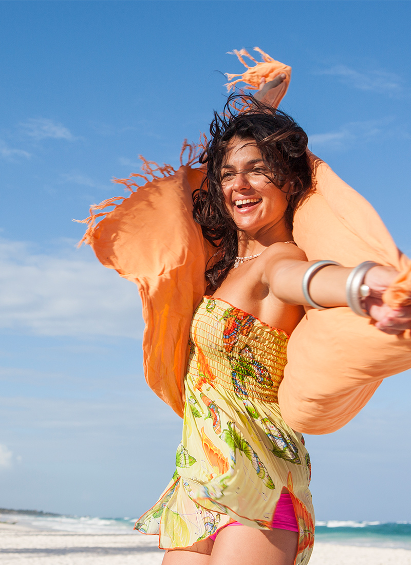 RCI Exchange Plus, Woman dancing on beach
