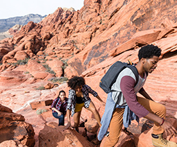 Three friends hiking in a canyon