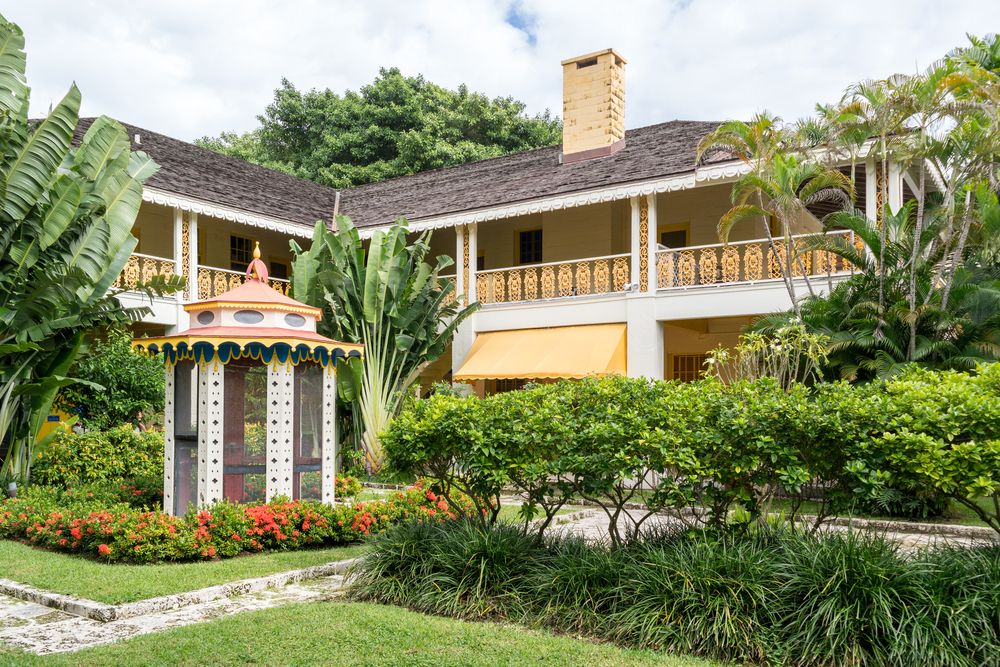 The main house is based on self-taught architect Frederic Bartlett’s interpretation of Caribbean plantation-style architecture.