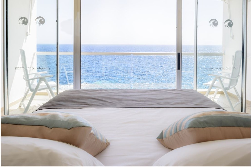 Wake up to a breathtaking view of the sea at Pearly Grey Ocean Club.