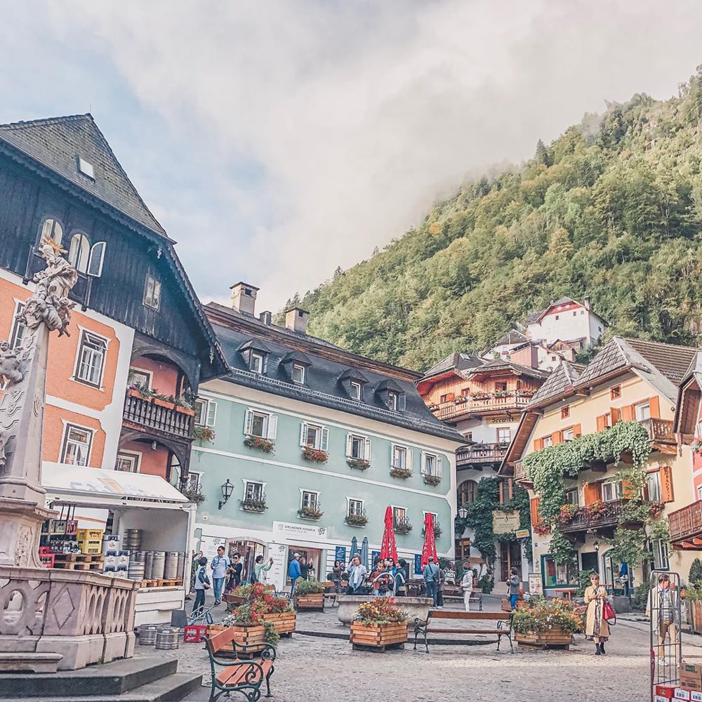 Colourful houses with flowers draped over the windows are a charming sight at Hallstatt.