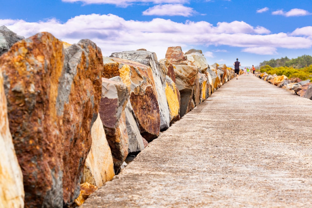 Explore the Breakwall Walking Path and check out the graffiti rocks.